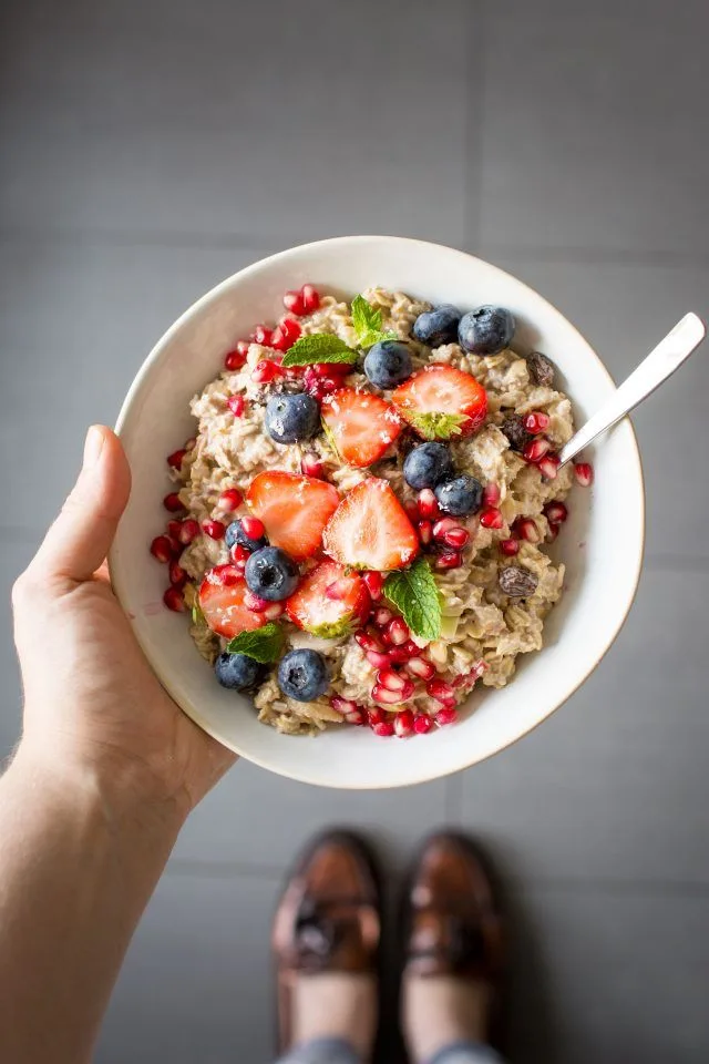 Bowl of oatmeal topped with fresh fruits like bananas, berries, and apples Healthy Breakfast