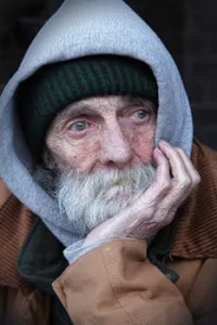 Portrait of an elderly man in a hoodie, capturing the essence of thought and introspection.